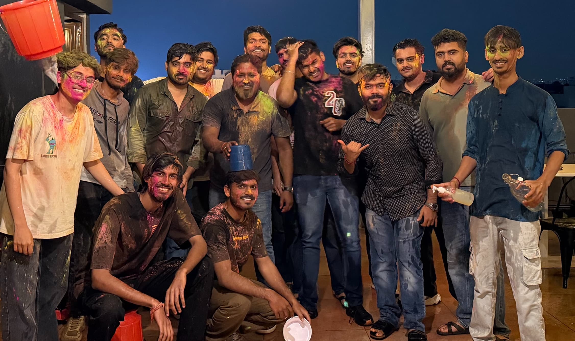 The team on the office terrace after Holi, still covered in colour